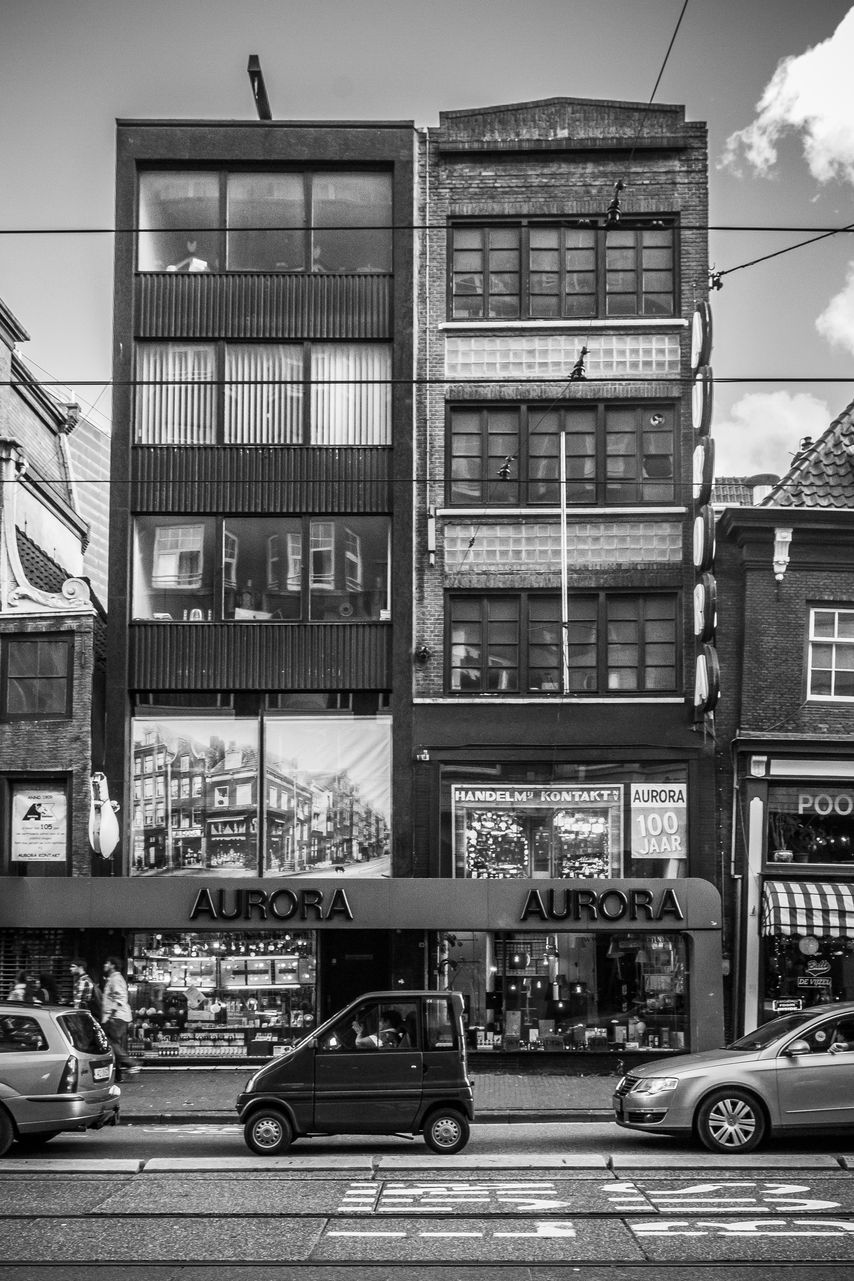 Amsterdam in B&W: The soul of the city wandering in the windows
